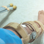 Services-Post-Surgical Picture of knee brace on a man's leg